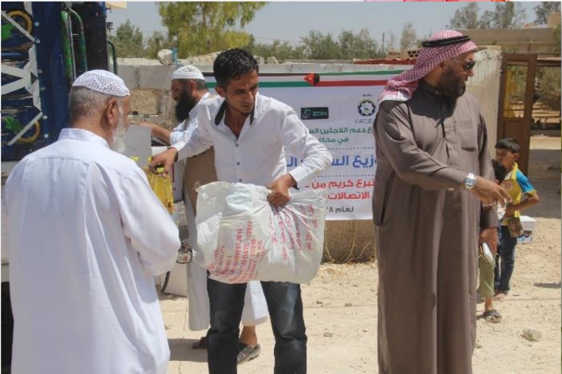 توزيع المساعدات على اللاجئين السوريين بالاردن.تبرعات عملاء زين